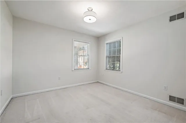 an empty room with windows