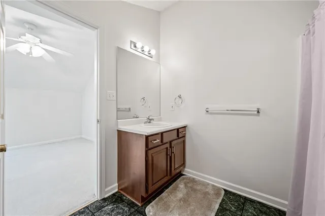 a utility room with cabinets washer and dryer