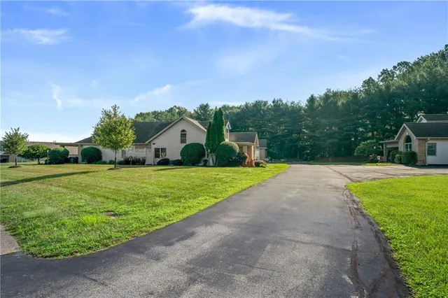 a view of a house with a big yard