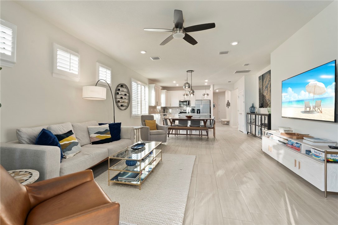 5208 Unity Square Vero Beach, FL 32967 - Photo 14 of 34 a living room with furniture and a flat screen tv