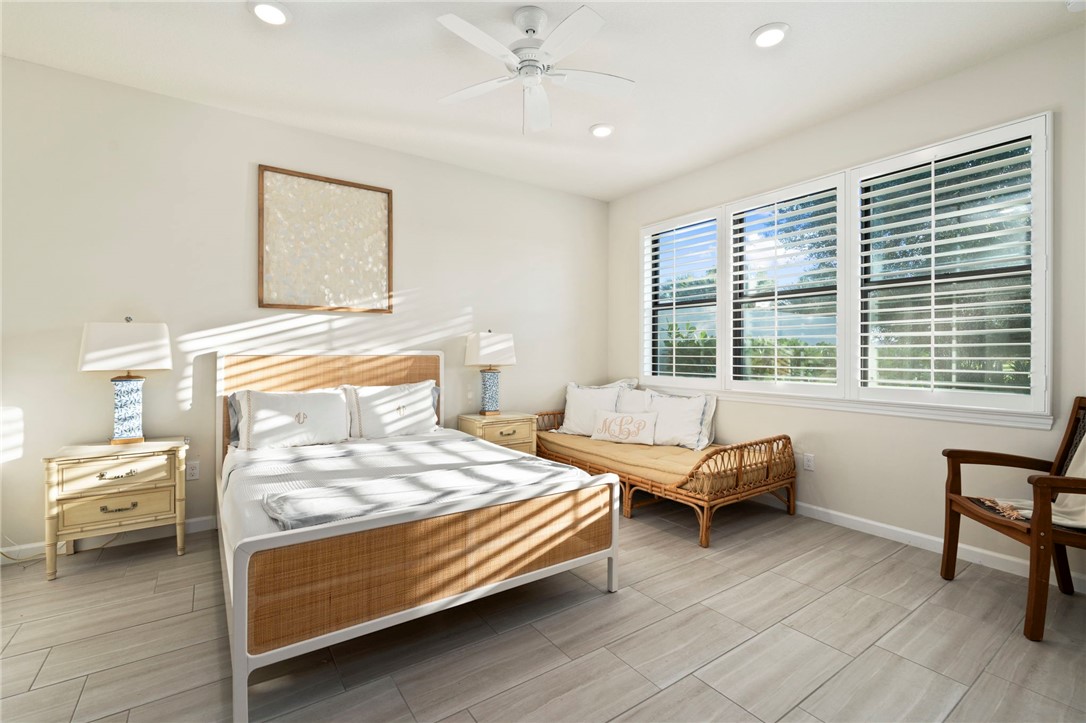 5208 Unity Square Vero Beach, FL 32967 - Photo 18 of 34 a bedroom with a bed and a window
