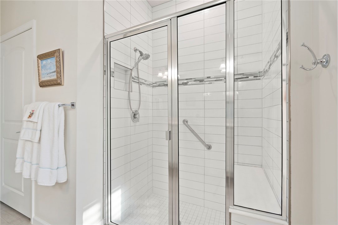 5208 Unity Square Vero Beach, FL 32967 - Photo 22 of 34 a bathroom with a glass shower door