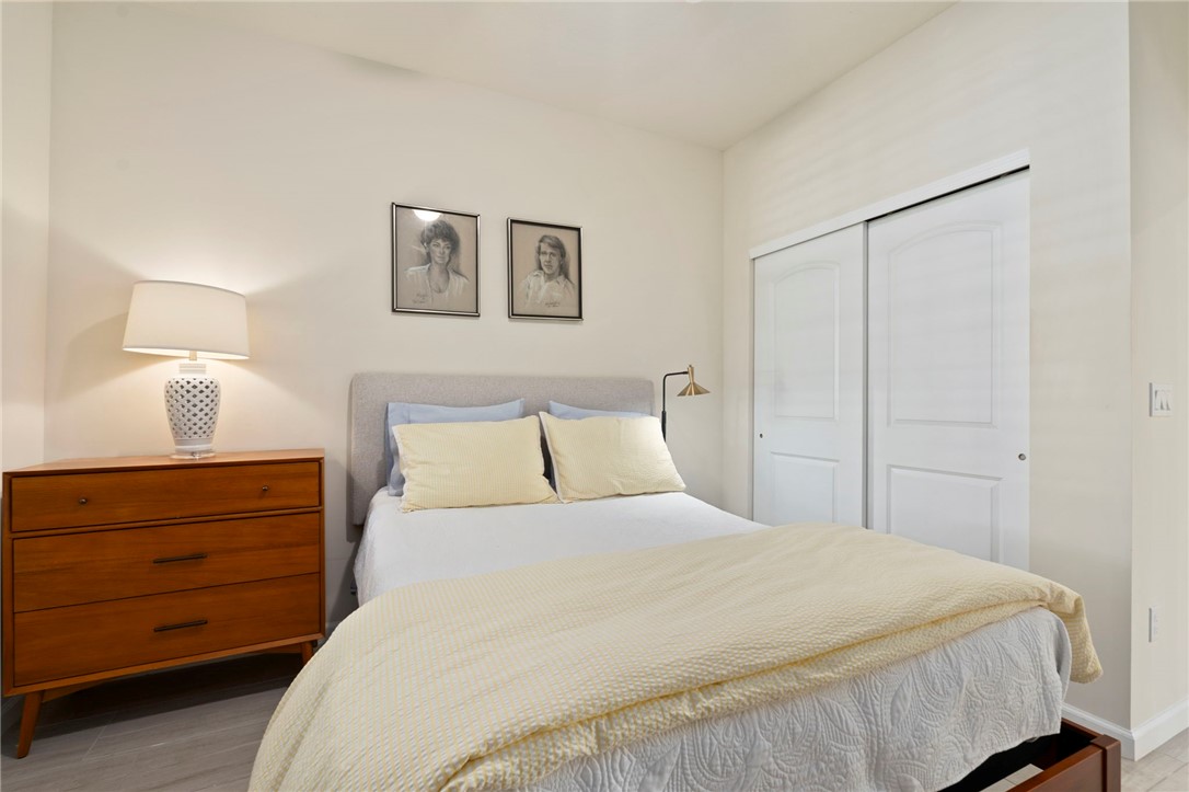 5208 Unity Square Vero Beach, FL 32967 - Photo 24 of 34 a bedroom with a bed and a closet