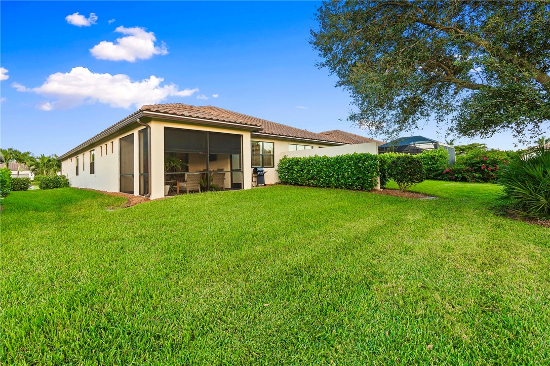 5208 Unity Square Vero Beach, FL 32967 - Photo 30 of 34 a front view of house with yard and green space
