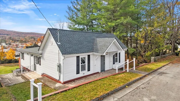 a front view of a house with a porch