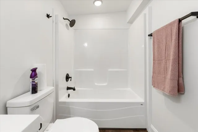a kitchen with granite countertop a sink stainless steel appliances and white cabinets