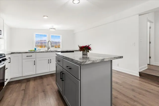 a bathroom with a sink toilet and mirror