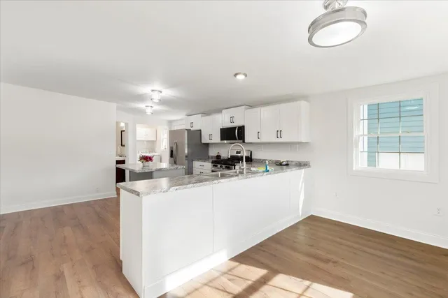 a bathroom with a sink vanity and a mirror