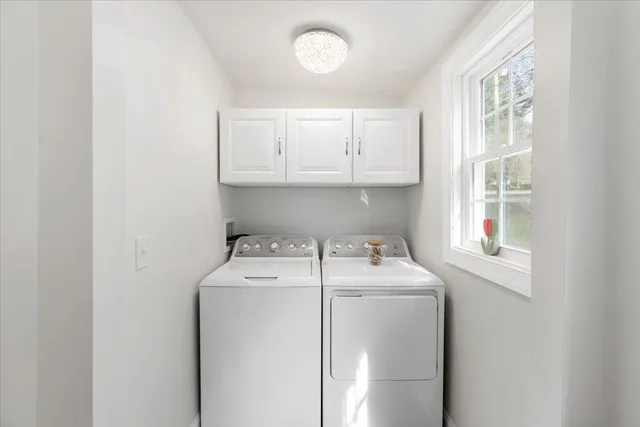 a room with a black white checkered floor with a gaming machine and wooden floor