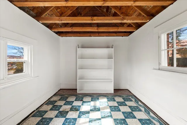 an aerial view of residential house with parking and mountain view
