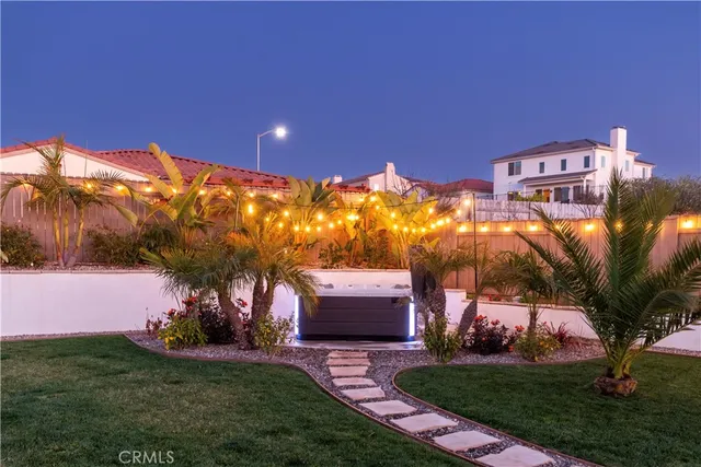 a view of a white house with many windows