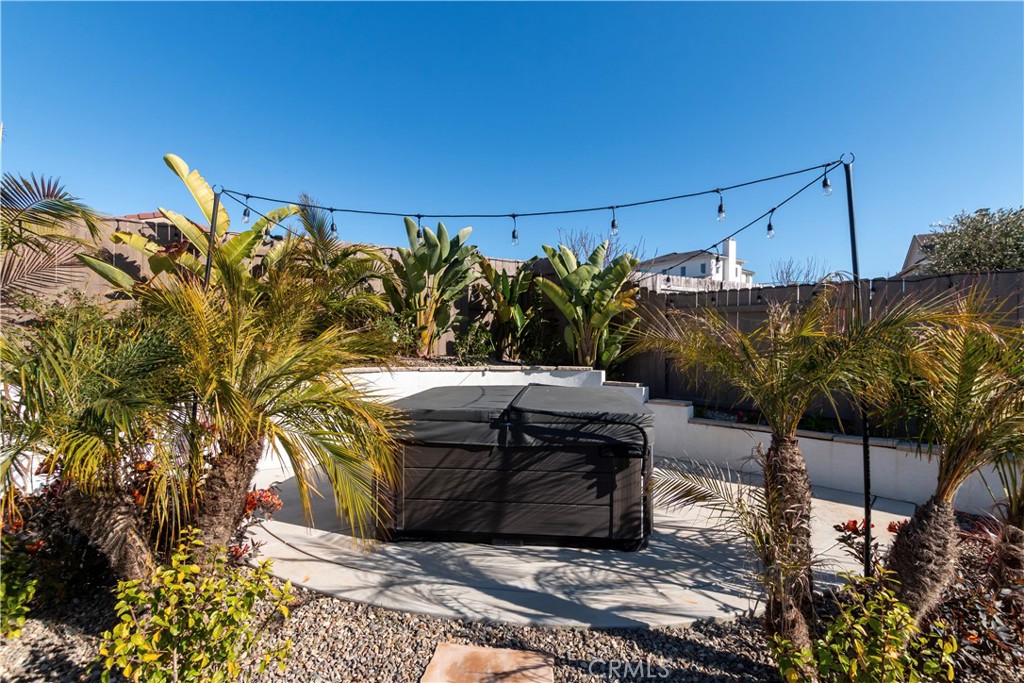 1275 Grand Meadow Way Santa Maria, CA 93455 - Photo 21 of 66 a view of a chairs and table in a backyard