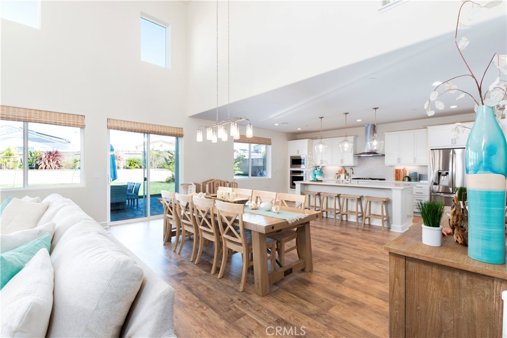 1275 Grand Meadow Way Santa Maria, CA 93455 - Photo 29 of 66 a living room with furniture a wooden floor and a large window