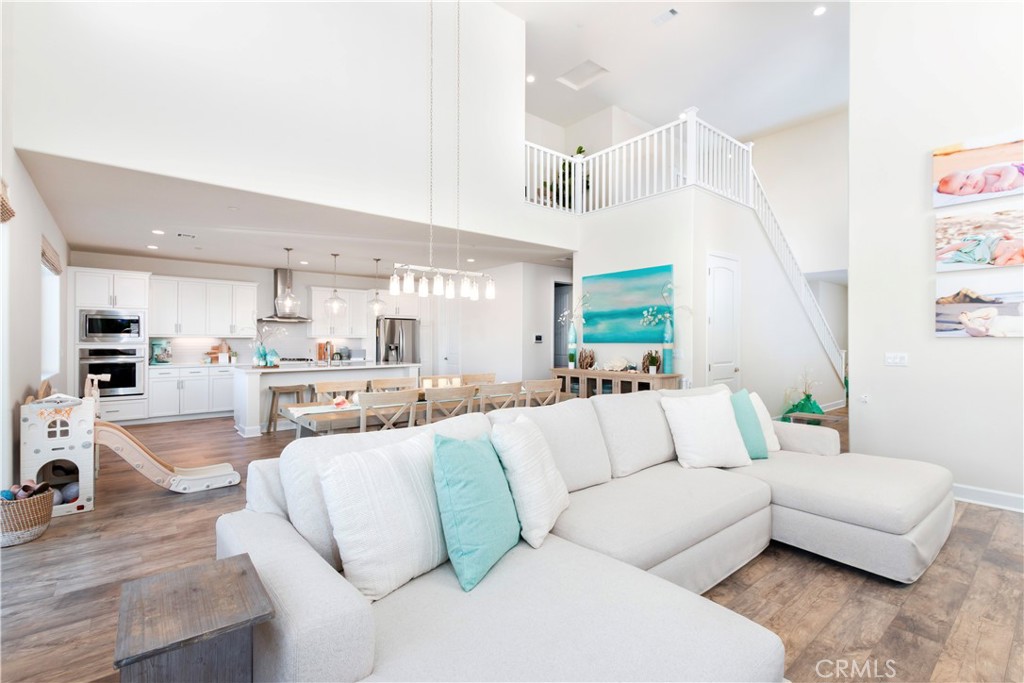 1275 Grand Meadow Way Santa Maria, CA 93455 - Photo 31 of 66 a living room with furniture and kitchen view