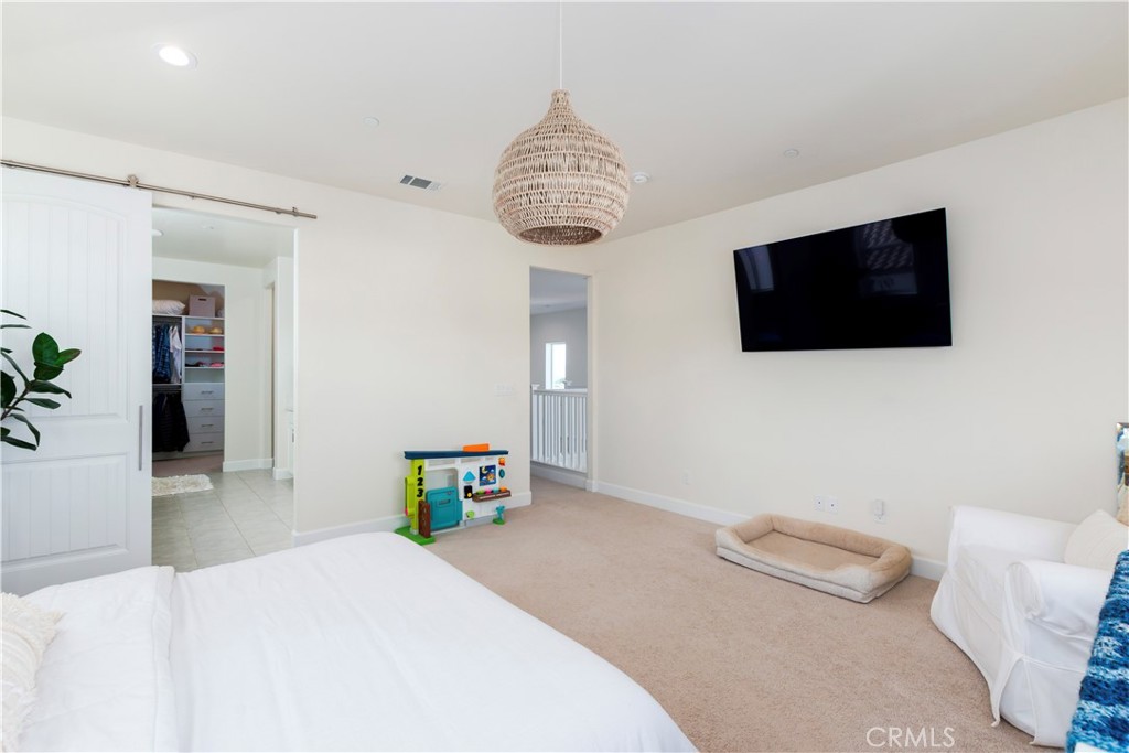 1275 Grand Meadow Way Santa Maria, CA 93455 - Photo 46 of 66 a bedroom with a bed and a flat screen tv