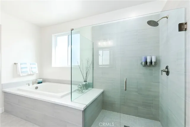 an aerial view of a residential houses with outdoor space