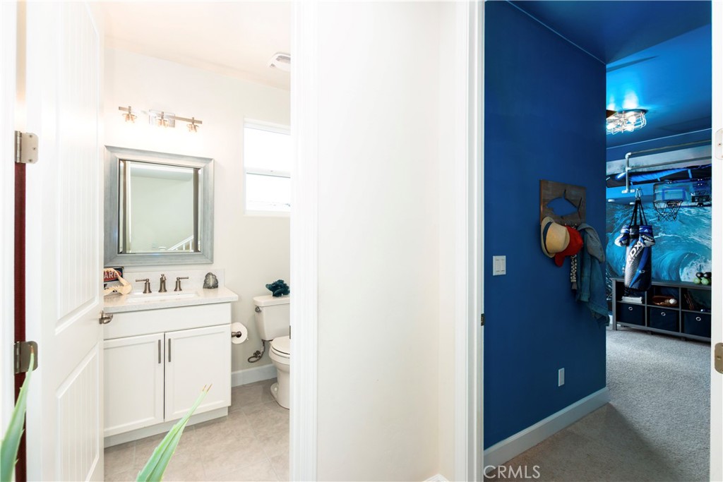 1275 Grand Meadow Way Santa Maria, CA 93455 - Photo 51 of 66 a bathroom with a toilet sink and mirror