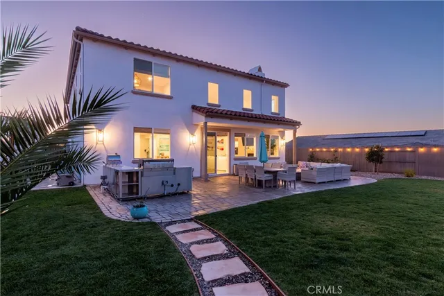a kitchen with stainless steel appliances a stove and a microwave