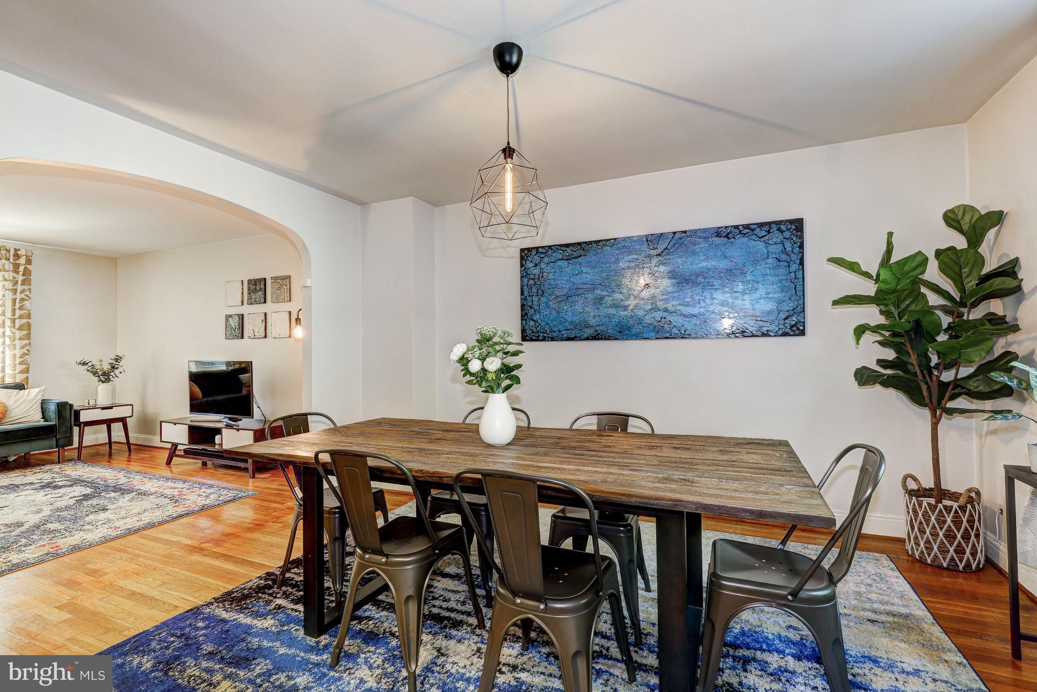 3908 Rexmere Road Baltimore, MD 21218 - Photo 11 of 39 a view of a dining room with furniture window and wooden floor