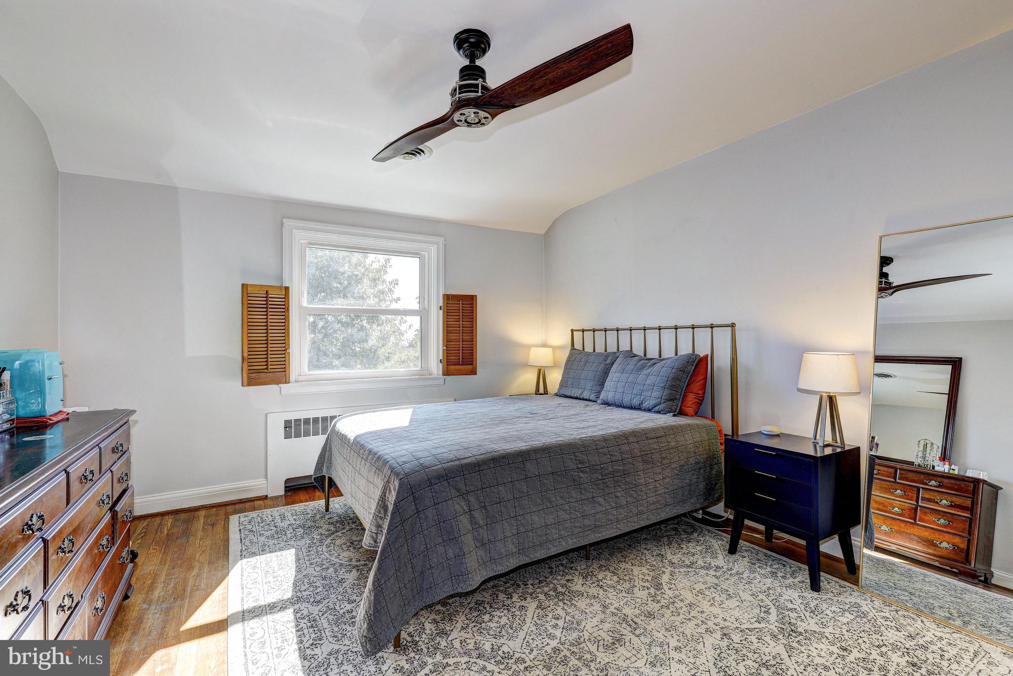 3908 Rexmere Road Baltimore, MD 21218 - Photo 17 of 39 a bedroom with a bed and a table in it