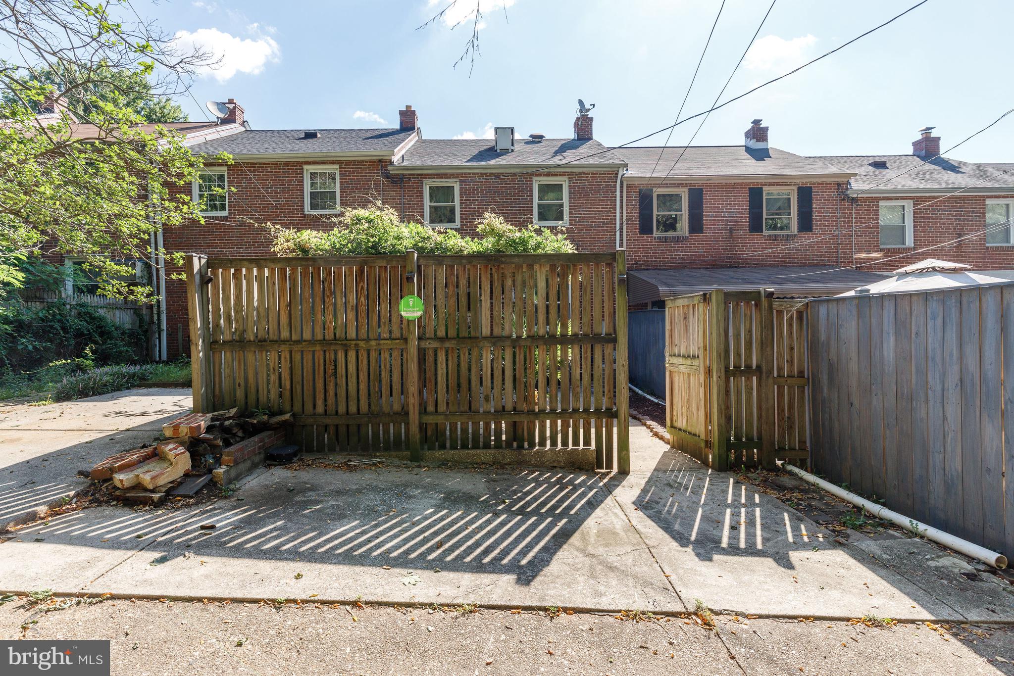 3908 Rexmere Road Baltimore, MD 21218 - Photo 30 of 39 a view of a brick house with large windows