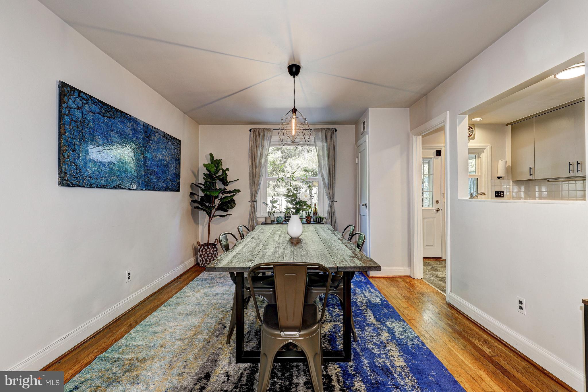 3908 Rexmere Road Baltimore, MD 21218 - Photo 3 of 39 a view of a dining room with furniture window and wooden floor