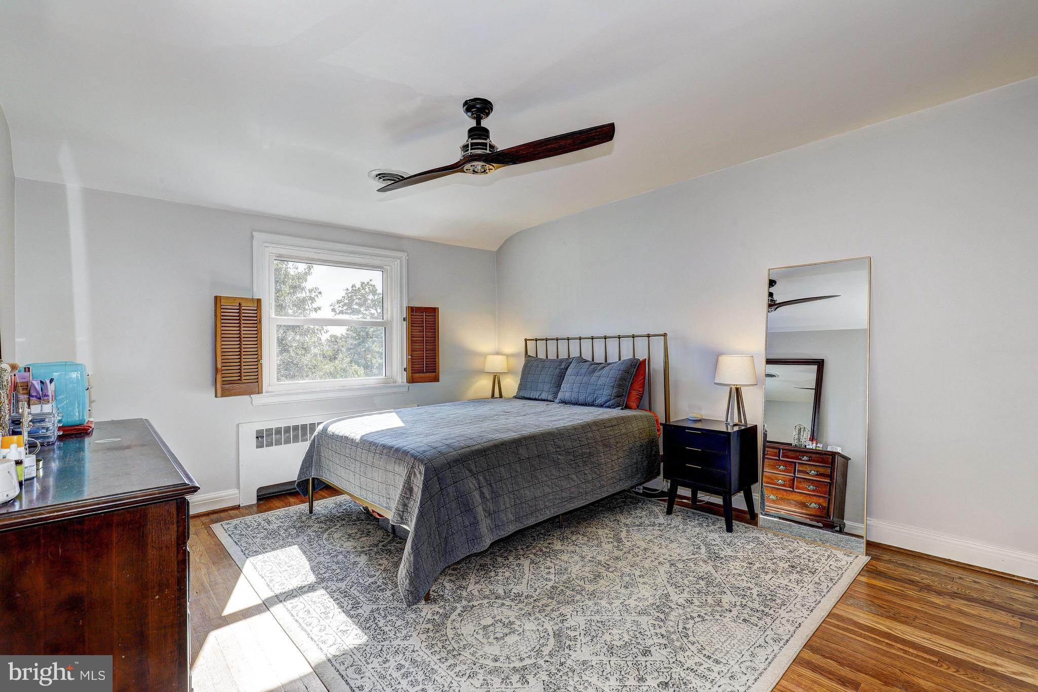 3908 Rexmere Road Baltimore, MD 21218 - Photo 5 of 39 a bedroom with a bed and a desk