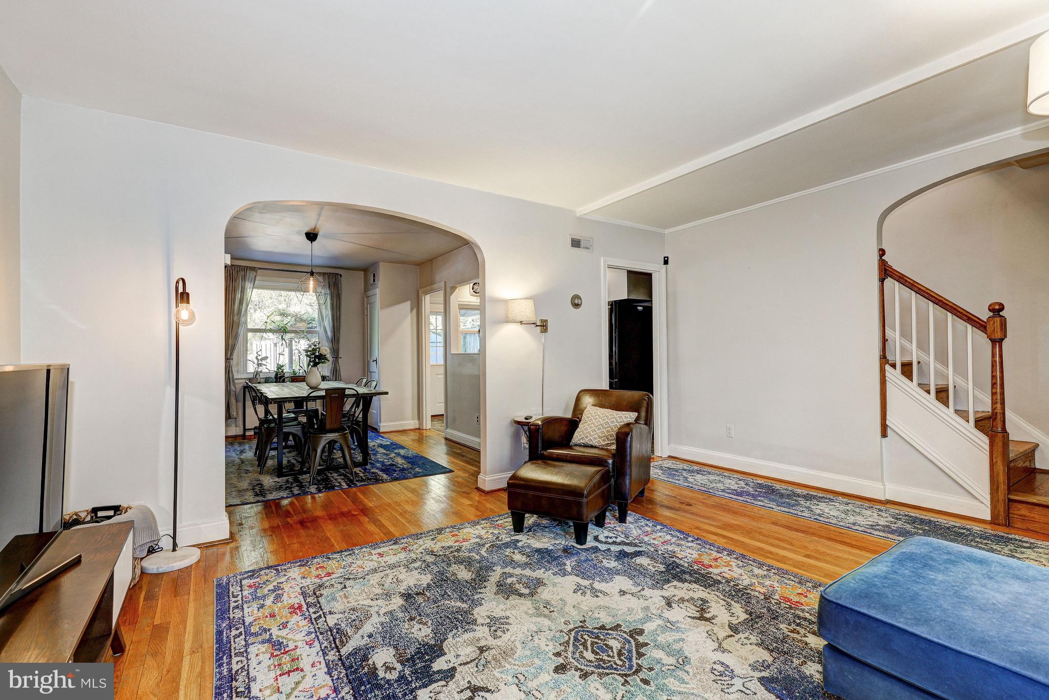 3908 Rexmere Road Baltimore, MD 21218 - Photo 10 of 39 a living room with furniture a rug and a large window