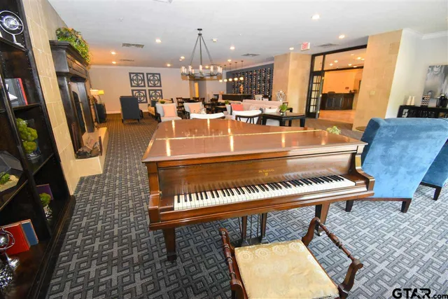 a view of a living room and kitchen with furniture