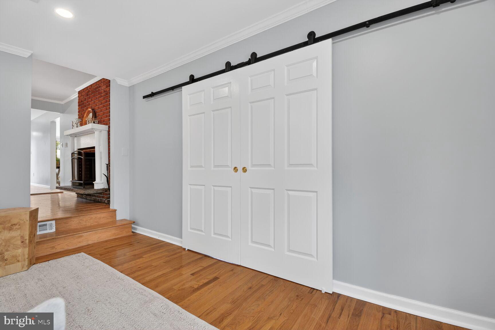 820 Brice Road Rockville, MD 20852 - Photo 15 of 26 Chic sliding doors enhance modern charm.