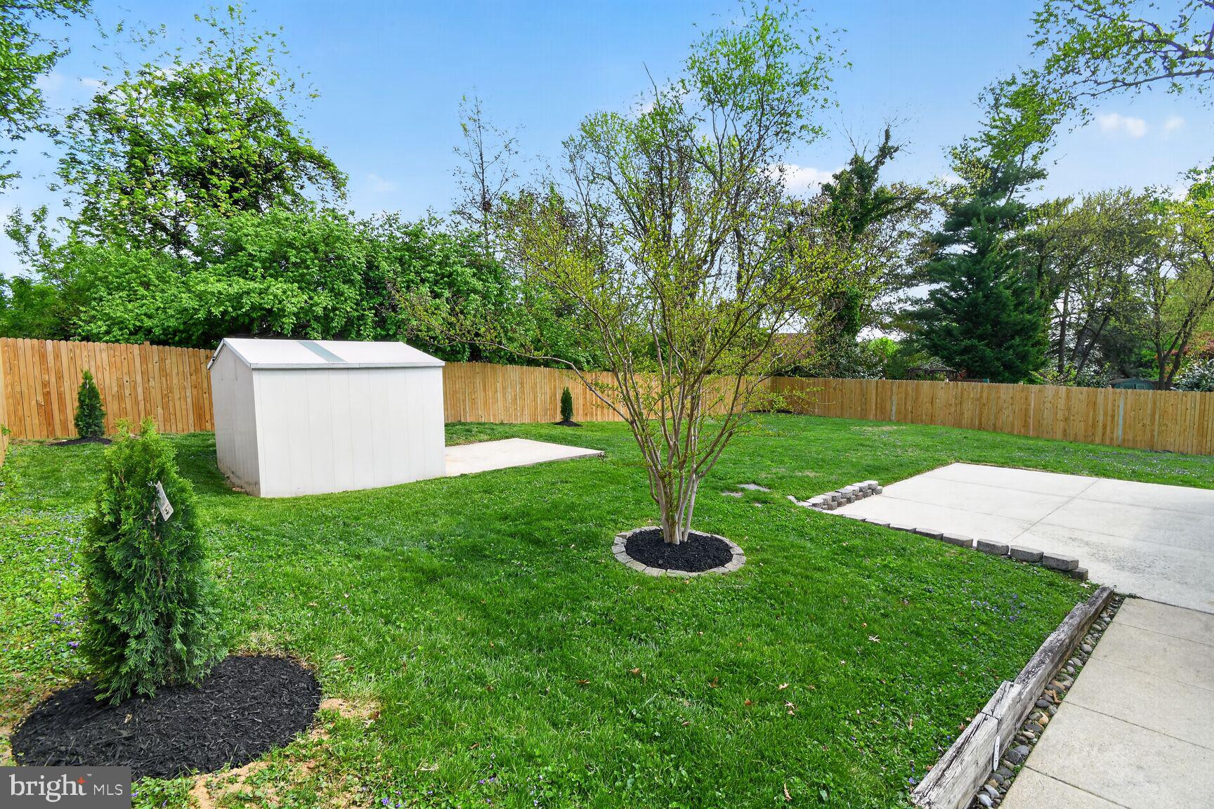 820 Brice Road Rockville, MD 20852 - Photo 26 of 26 Spacious yard with lush greenery.