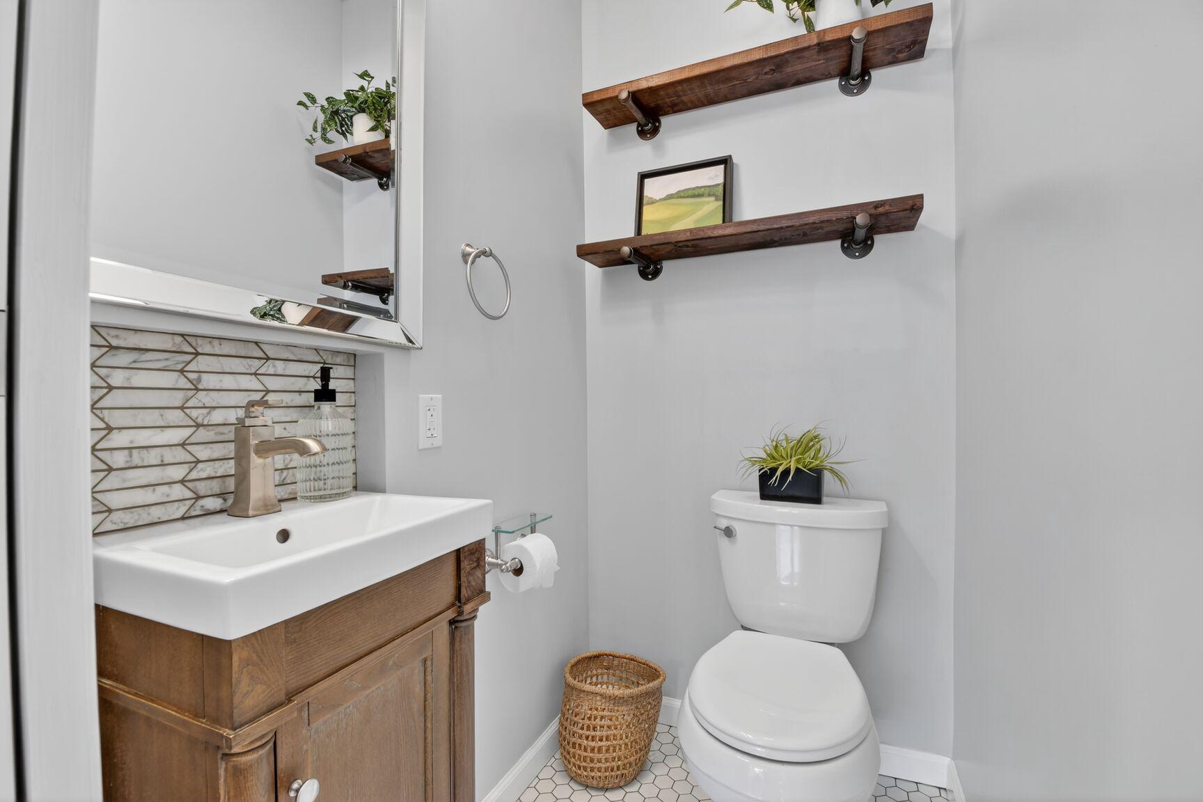 820 Brice Road Rockville, MD 20852 - Photo 8 of 26 Convenient half-bath with modern accents.