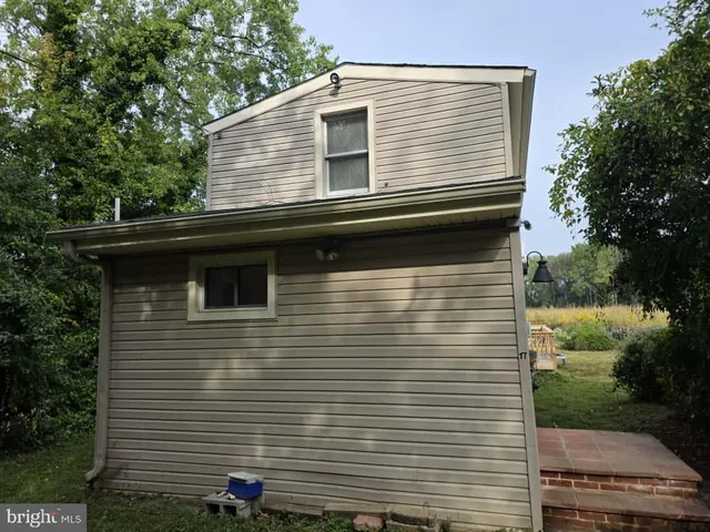 a view of a backyard with a garden