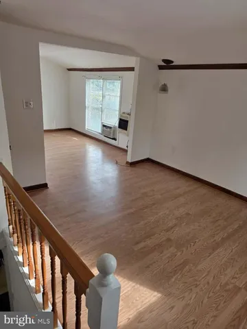 a view of a balcony with wooden floor and city view