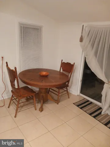 a stove top oven sitting inside of a kitchen