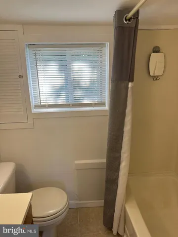 a bathroom with a toilet and a sink