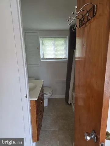a bathroom with a sink and toilet