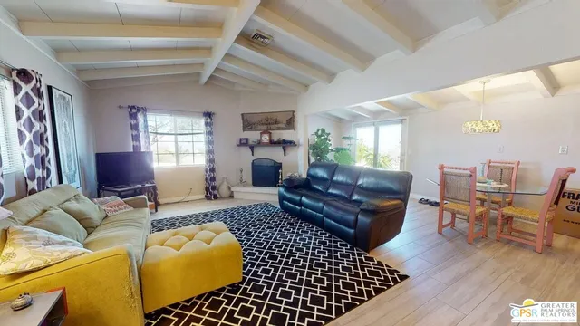 a living room with furniture and a rug