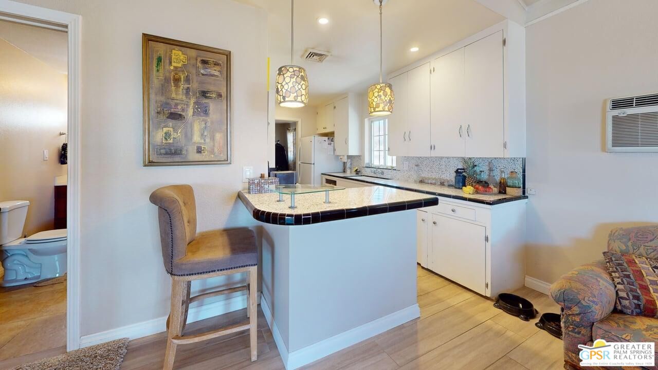 14701 Old Morongo Road Whitewater, CA 92282 - Photo 12 of 70 a kitchen with a dining table chairs and view of living room