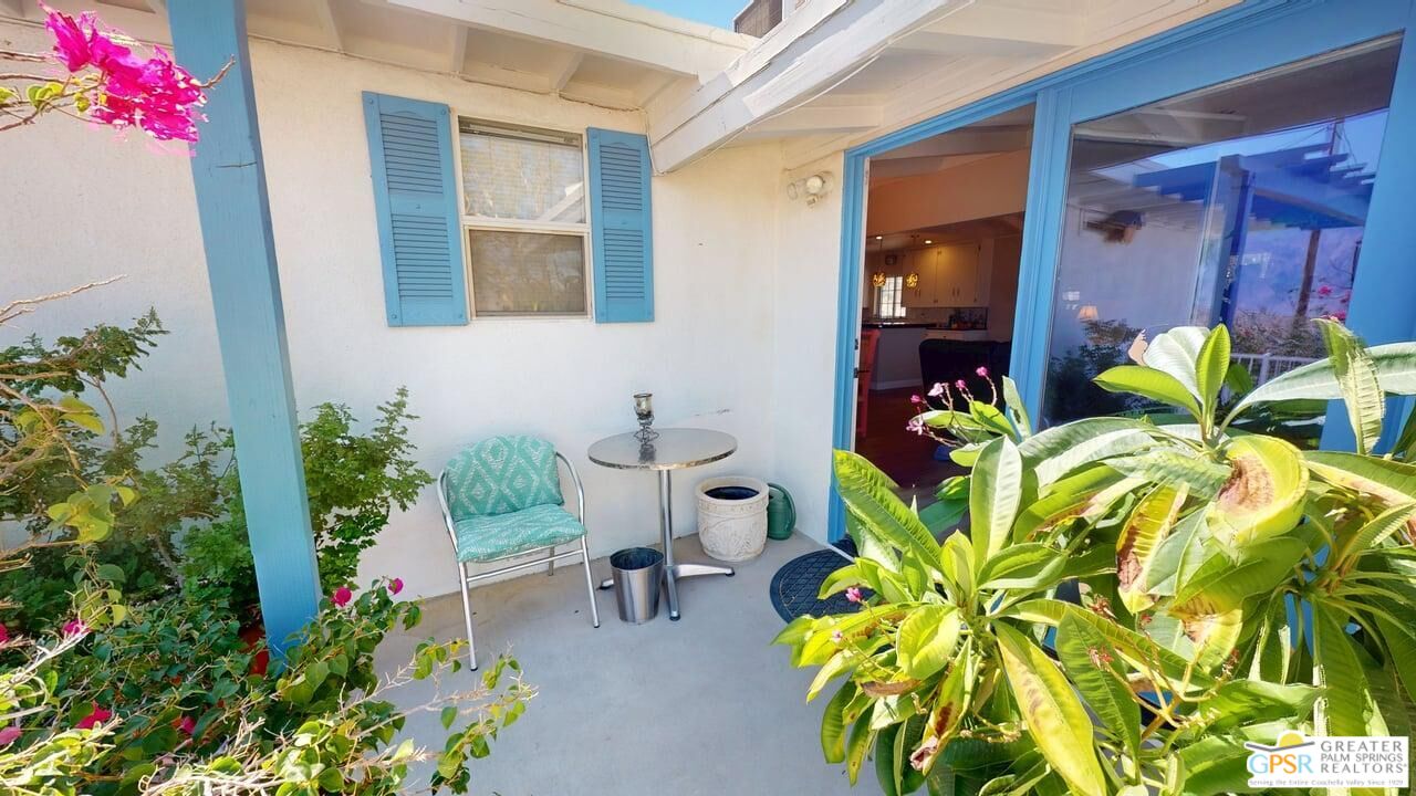 14701 Old Morongo Road Whitewater, CA 92282 - Photo 16 of 70 a view of a chair and table in a patio with potted plants