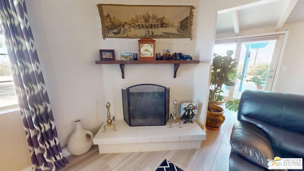 14701 Old Morongo Road Whitewater, CA 92282 - Photo 21 of 70 a living room with furniture and a painting on the wall
