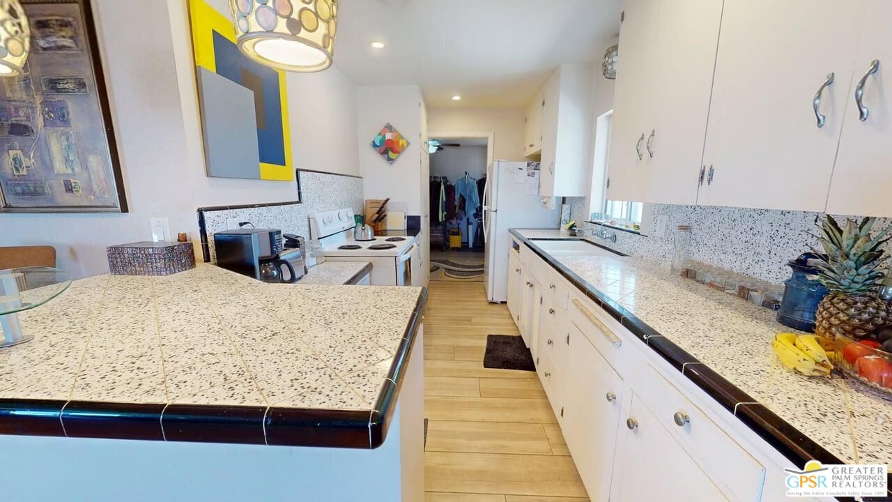 14701 Old Morongo Road Whitewater, CA 92282 - Photo 24 of 70 a spacious bathroom with a granite countertop double vanity sink and a mirror
