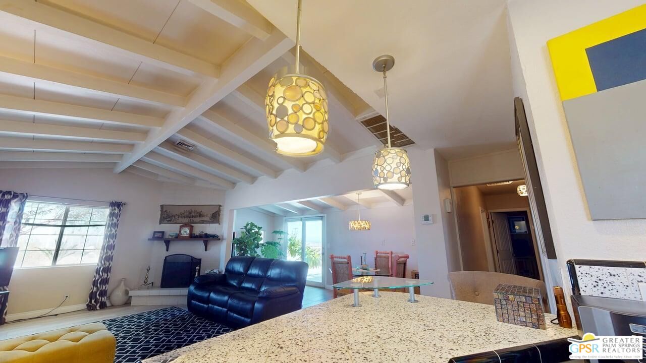 14701 Old Morongo Road Whitewater, CA 92282 - Photo 28 of 70 a living room with furniture and a clock