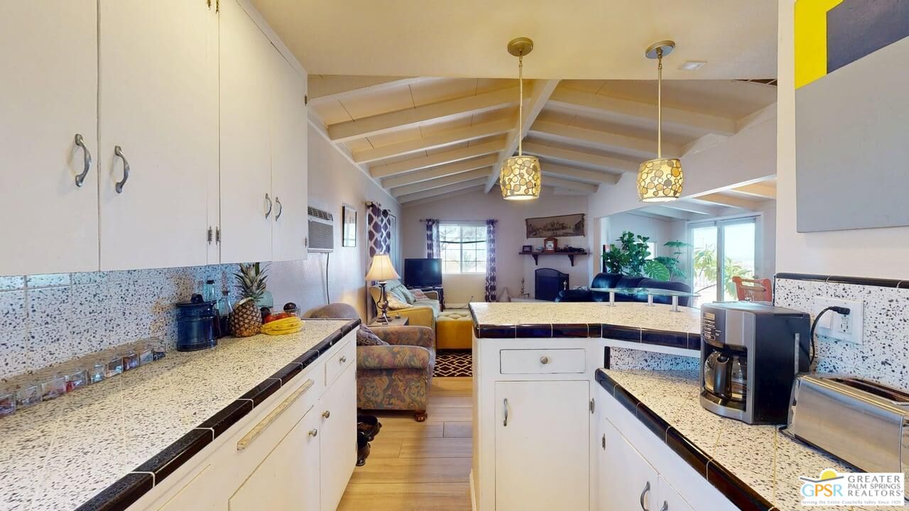14701 Old Morongo Road Whitewater, CA 92282 - Photo 32 of 70 a kitchen with stainless steel appliances granite countertop a sink and cabinets
