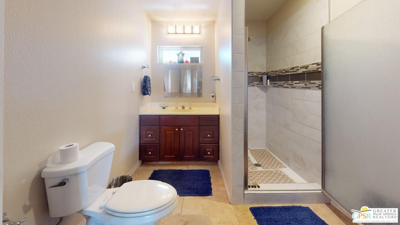 14701 Old Morongo Road Whitewater, CA 92282 - Photo 48 of 70 a bathroom with a toilet a sink and mirror