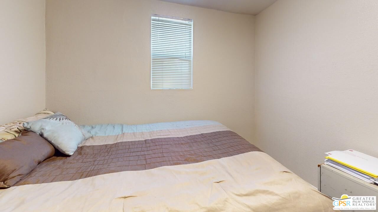 14701 Old Morongo Road Whitewater, CA 92282 - Photo 50 of 70 a bed sitting in a bedroom next to a window