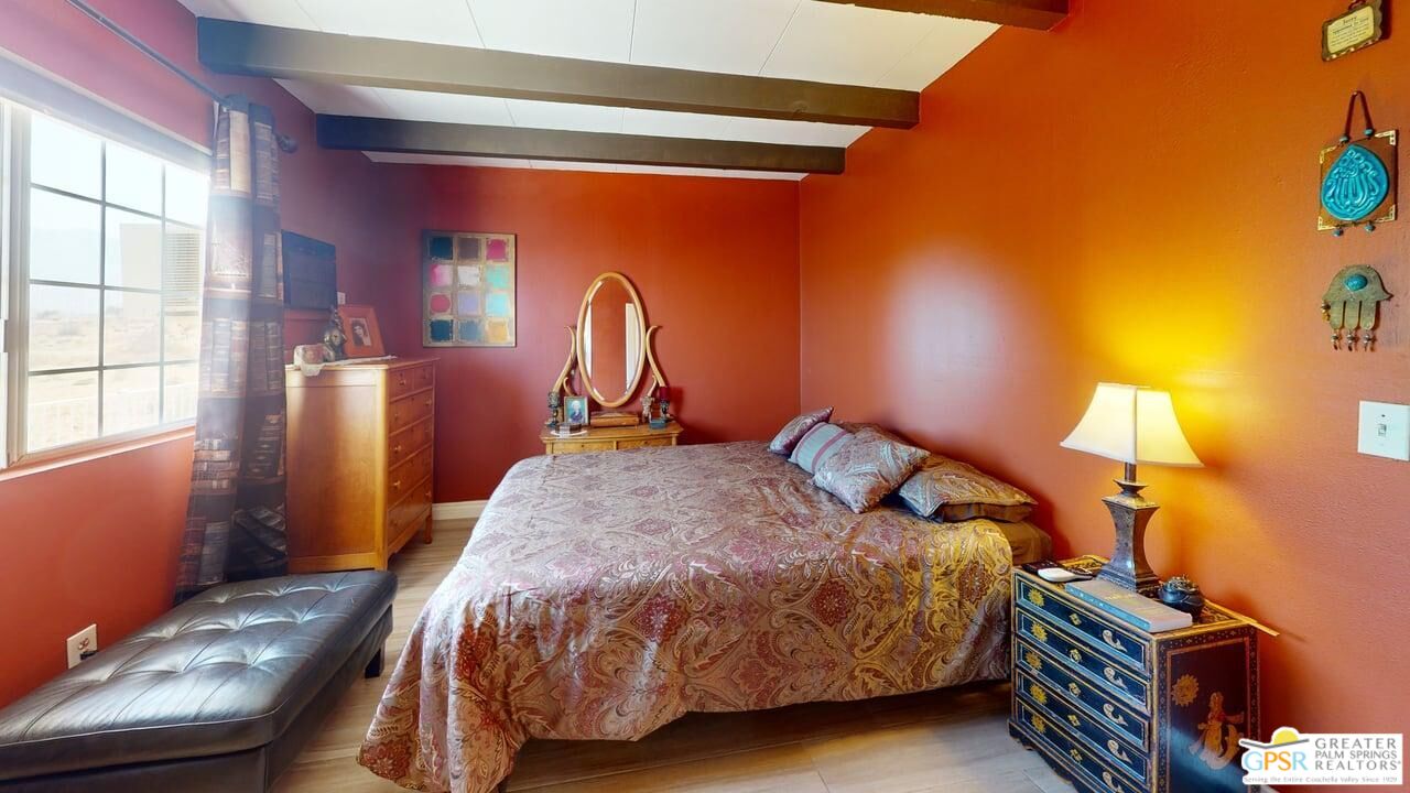 14701 Old Morongo Road Whitewater, CA 92282 - Photo 57 of 70 a bedroom with a bed and a window