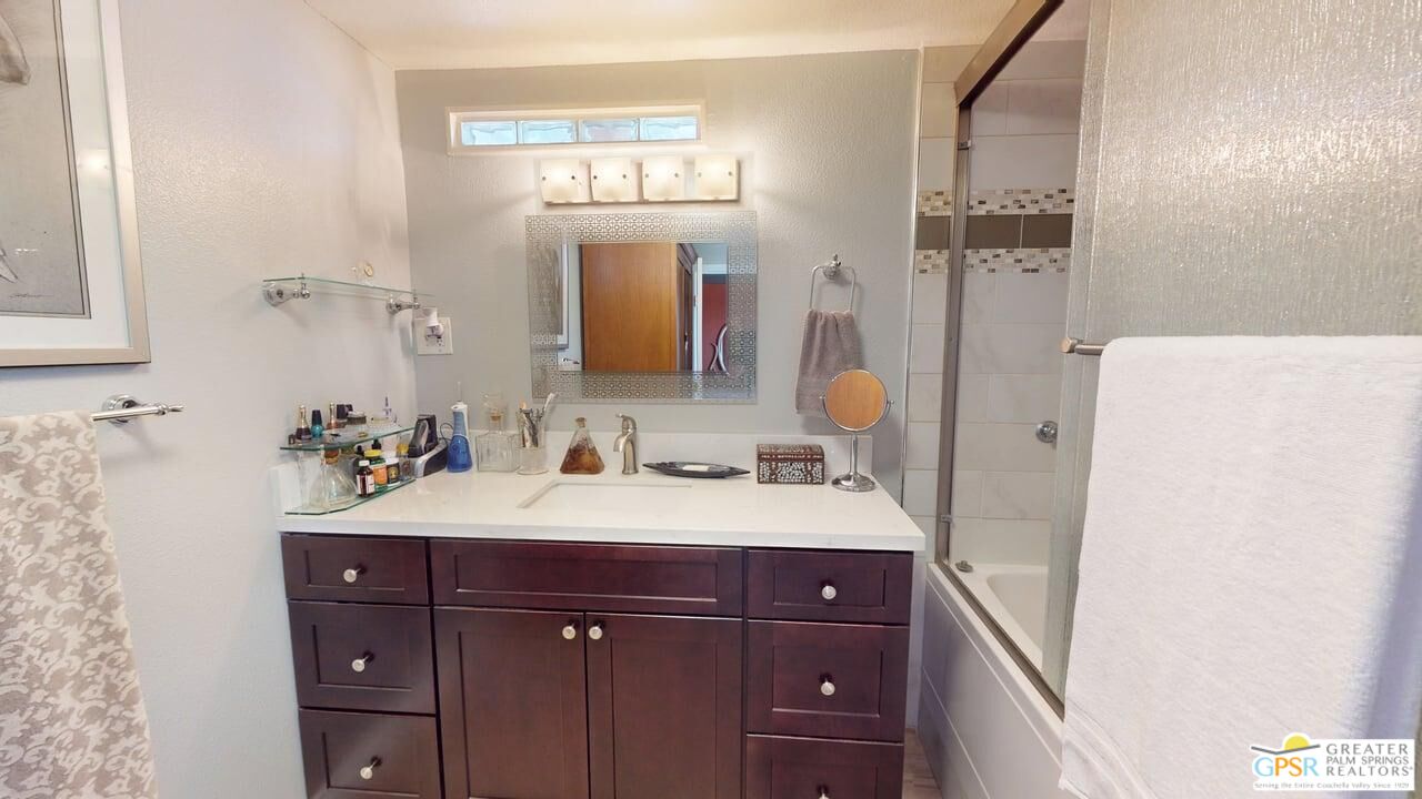 14701 Old Morongo Road Whitewater, CA 92282 - Photo 58 of 70 a bathroom with a sink vanity granite and a mirror