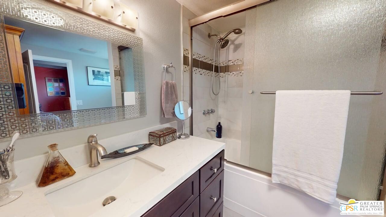 14701 Old Morongo Road Whitewater, CA 92282 - Photo 59 of 70 a bathroom with a sink vanity and a mirror