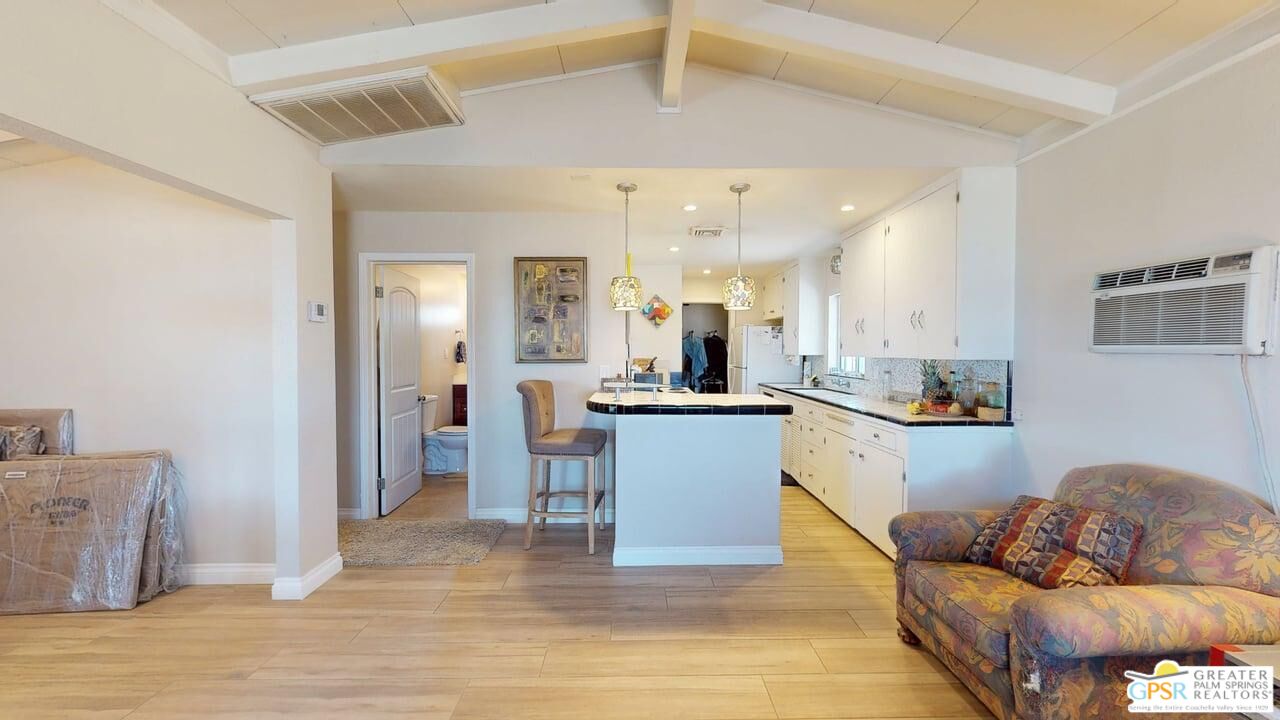 14701 Old Morongo Road Whitewater, CA 92282 - Photo 6 of 70 a living room with stainless steel appliances kitchen island granite countertop a couch and a view of living room